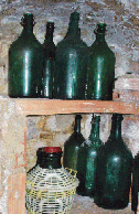 Italian art print of wine bottles in the cellar